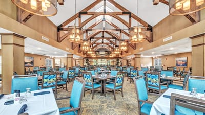 Bright, spacious dining area with colorful chairs