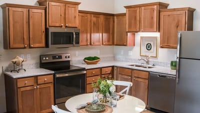 Modern kitchen interior with wooden cabinets and appliances