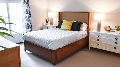 Bright, well-furnished resident bedroom in a retirement community