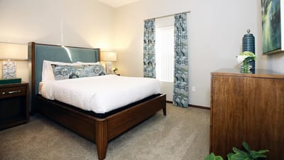 Well-furnished private bedroom in a retirement community