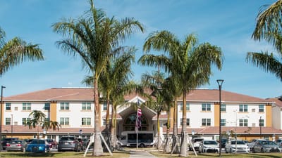 Outdoor view of Palomino Gardens with palm trees