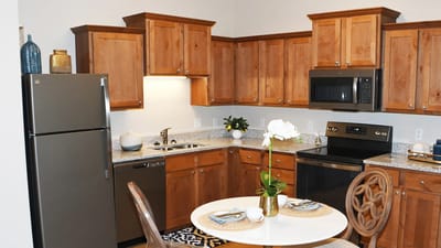 Modern kitchen setup with dining table and appliances