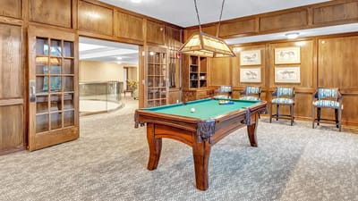 Interior view of a common area with a pool table