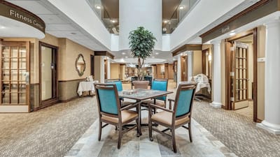 Common area with seating and decor in a senior living facility