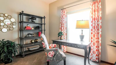 Brightly decorated interior corner with a desk and a chair