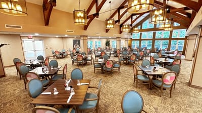Dining room with tables and chairs set for a meal