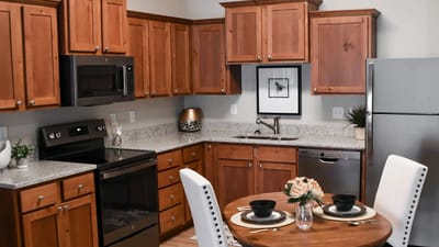 Modern kitchen space with dining table set for two