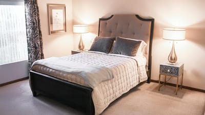 Cozy bedroom with a large bed and lamps