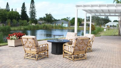 Outdoor seating area by a serene pond