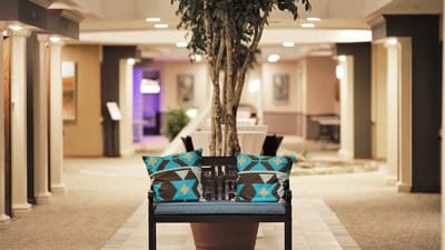 Interior hallway with a bench and decorative pillows