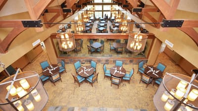 Spacious dining room with illuminated tables and chairs