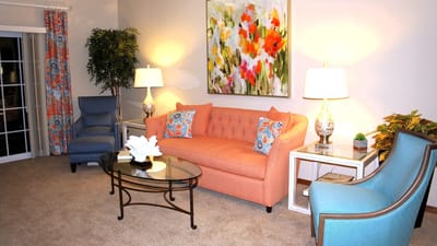 Cozy common area with colorful sofa and artwork