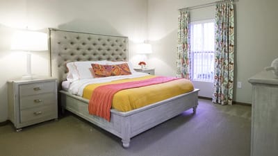 Bright and inviting bedroom with a colorful bedspread