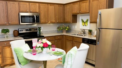 Cozy kitchen interior with flowers on table
