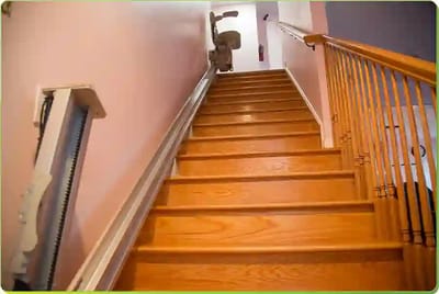 Wooden staircase with a stairlift