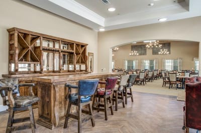 Dining area with chairs and wooden bar