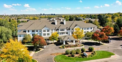 Aerial view of Woodland Estates with colorful landscaping