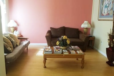 Cozy interior lounge with light-colored walls and seating