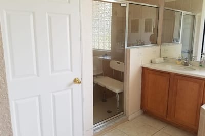 Bathroom with shower and accessible seating