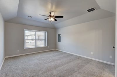 Empty interior room with carpet and ceiling fan