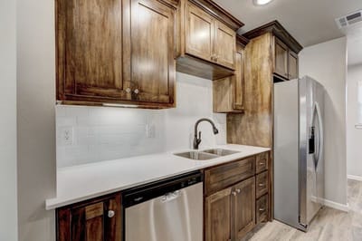 Modern kitchen interior with wooden cabinets and stainless steel appliances