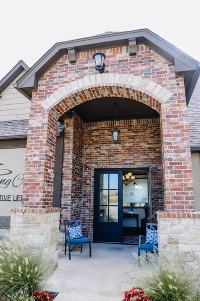 Entrance of a senior living facility with brick architecture