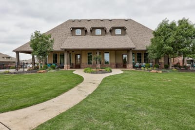 Exterior view of Whispering Creek facility with landscaping