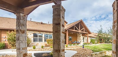 Outdoor view of the facility's entrance and landscaping.