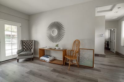 Cozy interior space with a chair and decorative mirror