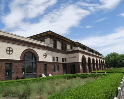 Exterior view of a building with landscaped garden.