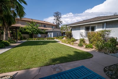Outdoor space with well-maintained garden and buildings