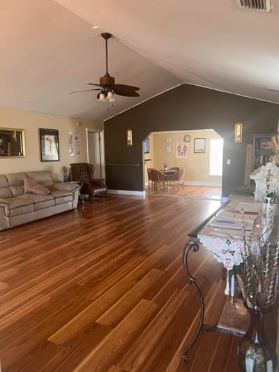 Bright common area with wooden floors and seating