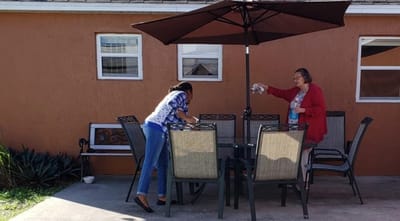 Residents interacting in an outdoor seating area