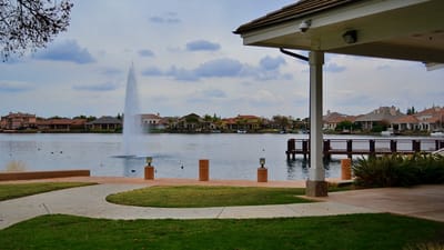 View of a serene outdoor lake with fountain