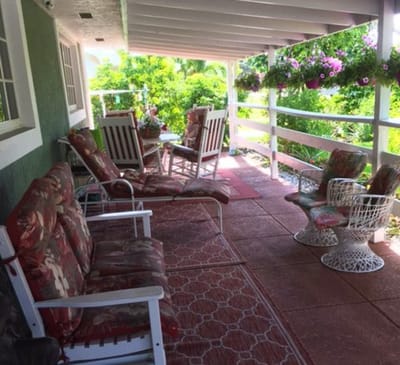 Outdoor seating area with flowers and furniture