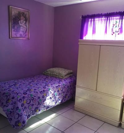 Cozy private resident room with purple decor
