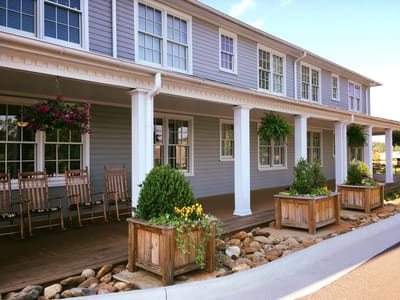 Exterior view of a senior living facility with a porch