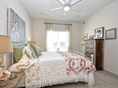 Cozy private resident room with bed and decor