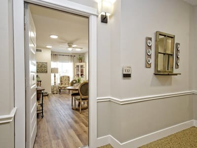 Hallway leading to a resident room with decor