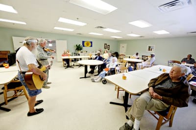 Residents enjoying live music in a common area