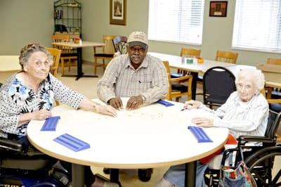 Residents playing a game together in a communal area