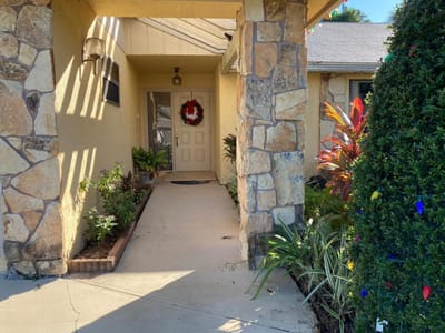 Entrance to a senior living facility with festive decor