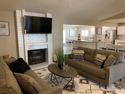 Interior common area with seating and a fireplace
