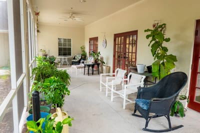 Bright interior corridor with seating and plants