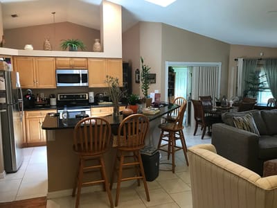 Spacious kitchen and living area in an assisted living facility