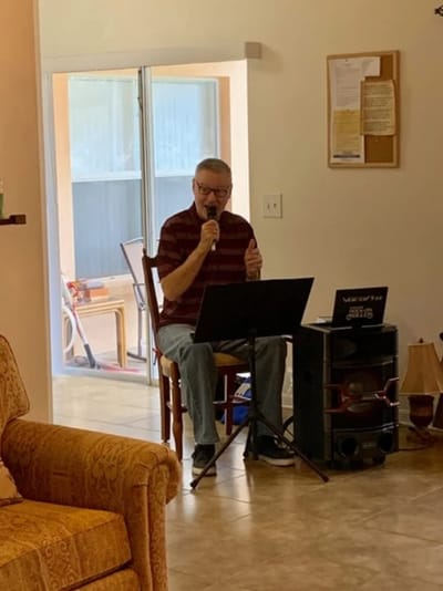 Resident enjoying music in a communal space