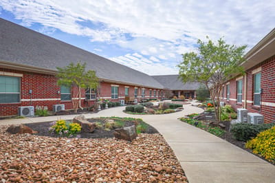 Outdoor garden pathway with landscaped areas