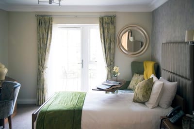 Cozy resident room with a bed and seating area