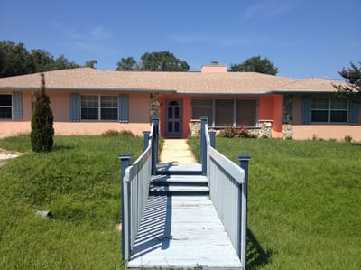 Exterior view of a residential building with a walkway