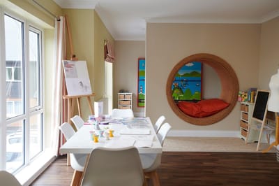 A colorful common area with a creative play space